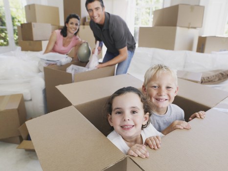 Careful loading of household items into a Twickenham removal van