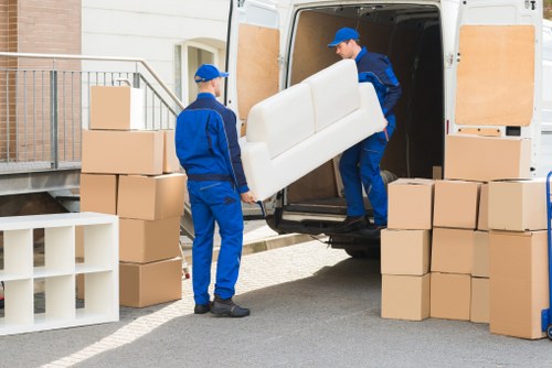 Removal van team following safe working practices
