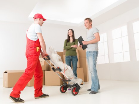 Team organizing furniture and boxes inside a removal van in Twickenham