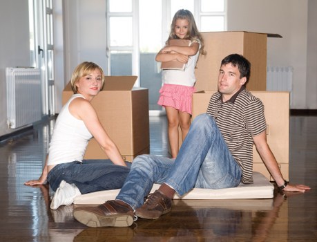 Careful loading of furniture and boxes into a removals van for a Twickenham home move